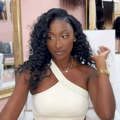 Grecian Greatness Long Curly Weave with Side Part