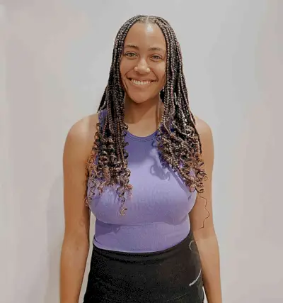 Chest-Length Brown Knotless Box Braids with Center Part and Curly Ends