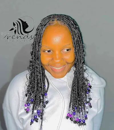 Medium-Length Knotless Goddess Braids with Purple Beads
