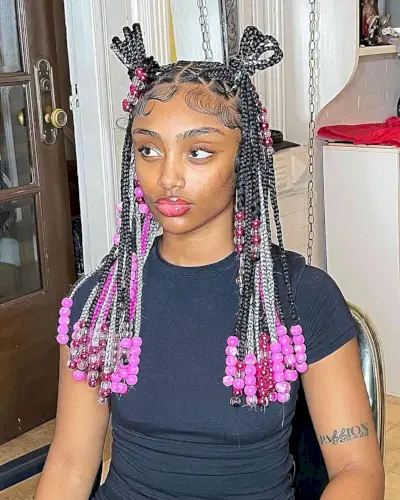 Chest-Length Triangle Knotless Braids with Pink Beads