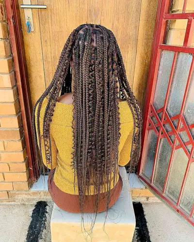 Butt-Length Knotless Medium Braids with Curls for Brown Hair