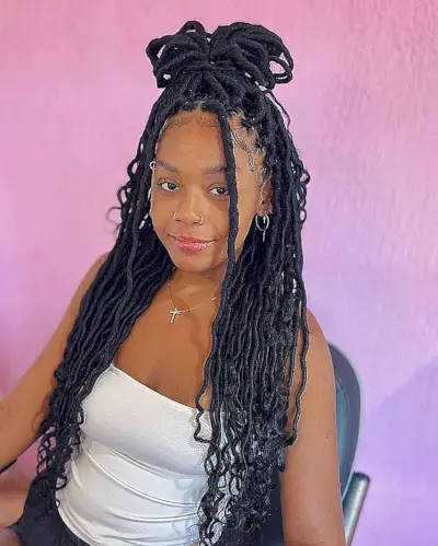 Crochet Faux Locs with Curly Ends and a High Bun for stylish black ladies