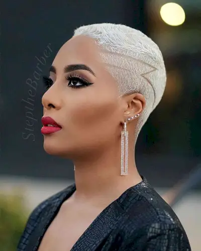 Very short natural undercut with shaved designs