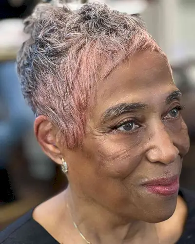 Cute Pixie Cut with Pink Highlights for older Black women with choppy fringe