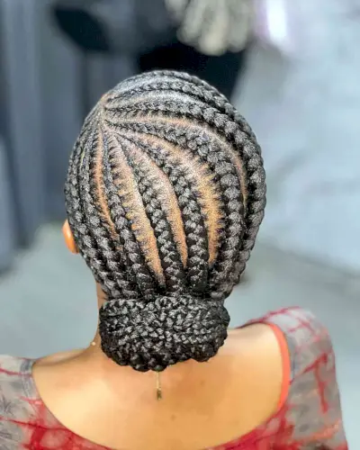 Side-Parted Stitch Braids with Low Bun