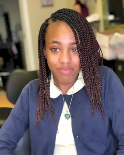 Simple medium-long box braids with side part