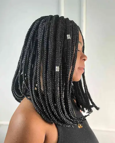 Medium-Length Box Braids on an Extra Long Bob with Silver Cuffs