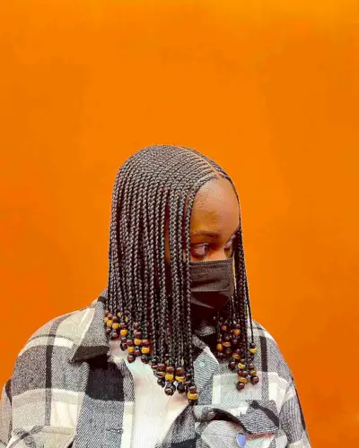 Mid-length box braids with beads