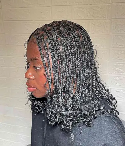Shoulder-Length Small Boho Knotless Braids with Curly Ends