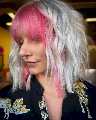 Icy White Blonde with Face-Framing Pink Bangs on women with shoulder-length hair