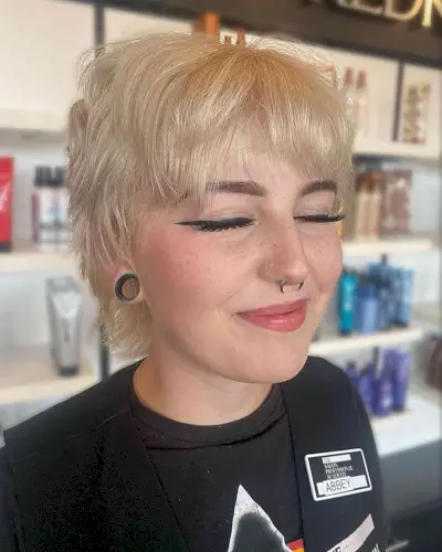 Pale Blonde on Soft Tousled Pixie Hair with Choppy Layers and Bangs