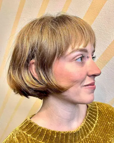 Trendy Honey Blonde Ear-Length Bob with Bangs