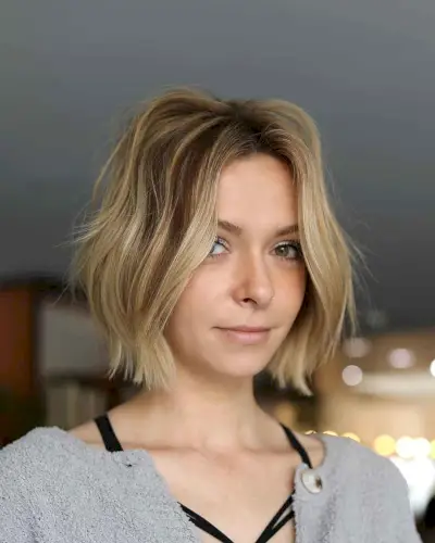 Casual brown angled bob with blonde highlights