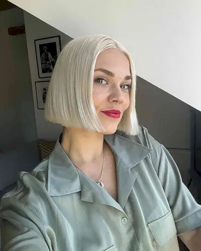 Sleek and Blunt Short Blonde Bob with a middle part