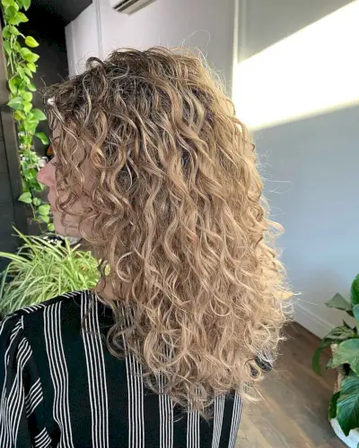 Blonde Curly Hair with Lowlights