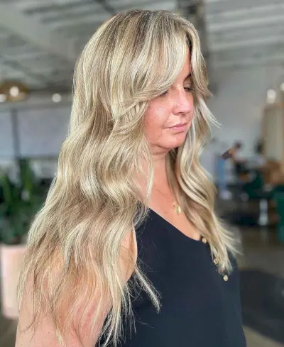 messy french vanilla long blonde with layers