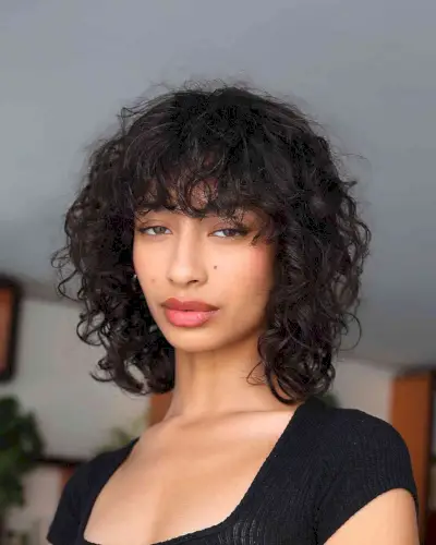 Messy Wet Curls with Thick Bangs