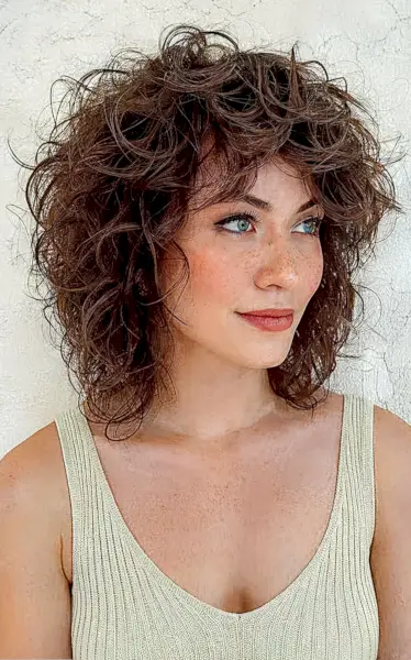 Shoulder-Grazing Shaggy Bob Cut with Textured Curls