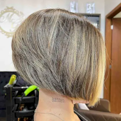 nicely stacked angled bob with blonde highlights