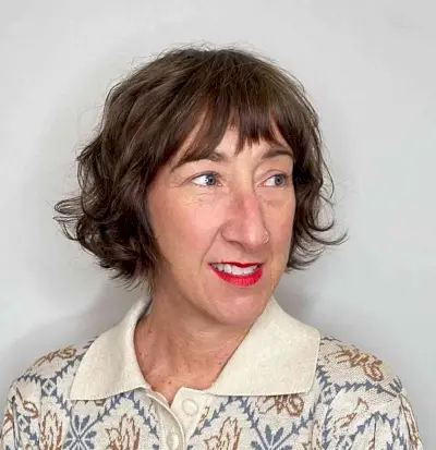 Feathered Razored French Bob with Asymmetrical Bangs for Older Women