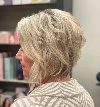 Short Stacked Textured Bob with Long Front Layers on Blonde Hair