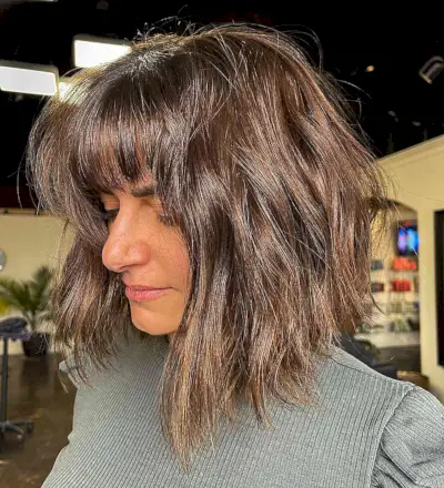 Face-Framing Tousled Textured Long Bob with Straight Bangs and Textured Ends