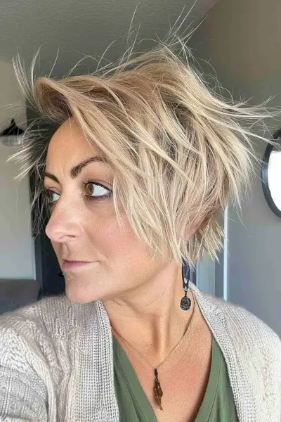 Woman with an edgy long choppy pixie bob hairstyle