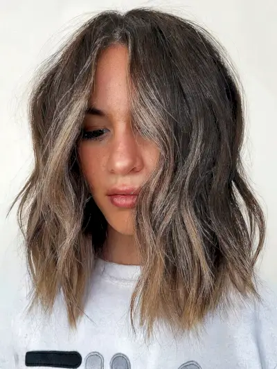 Modern Choppy Lob with a Light Brown Money Piece