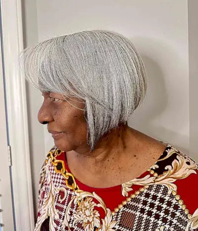Jaw-Length Graduated Silver Bob with Side Bangs for Older Women