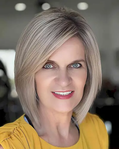 Sweeping Bangs on a Short Layered Bob for women in their 40s with thick hair