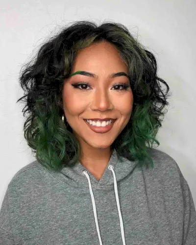 Layered Wavy Shaggy Bob on Dark Hair with Green Highlights