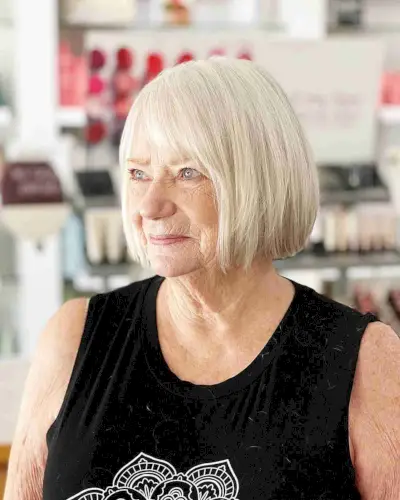Chin-Length White Blonde Bob with Side Bangs for Women Over 60