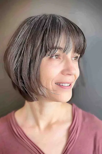 Chin-length layered bob with bangs for fine hair