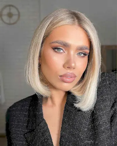 sleek slightly angled bob with a middle part