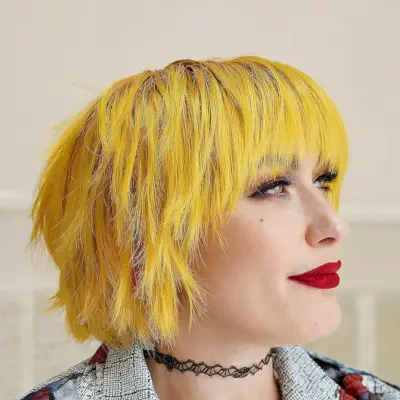 Vivid Yellow Shaggy Bob with Long Bangs