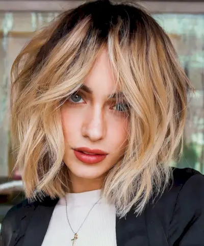 blonde shaggy bob with dark roots