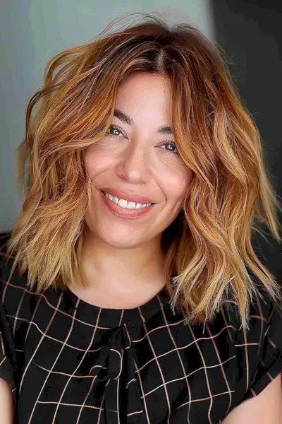 shaggy shoulder-length bob and copper balayage