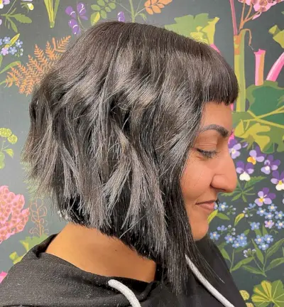 A-line Haircut with Choppy Layers and Baby Bangs