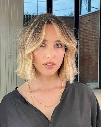 Chic Blunt Bob with Curtain Bangs and dark roots