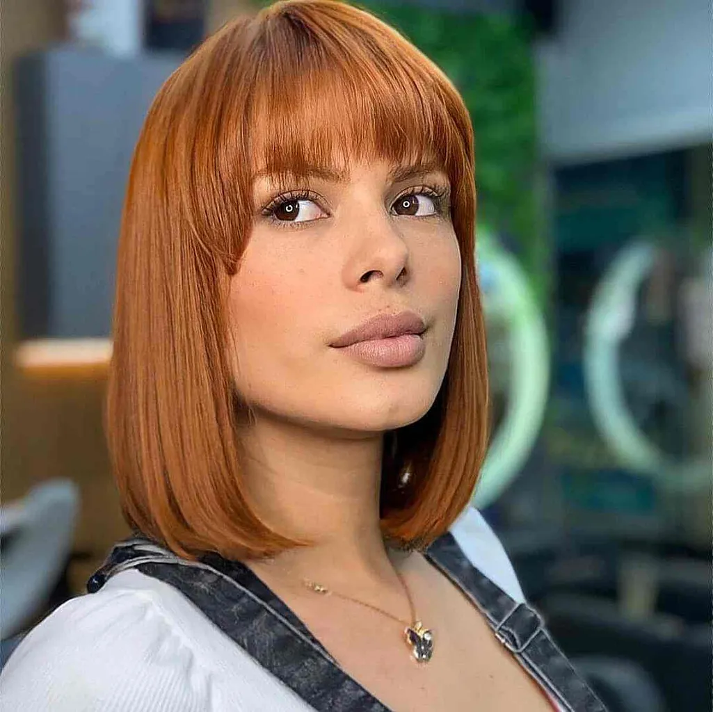 시스루 프린지가 있는 선명한 구리 로브' title=