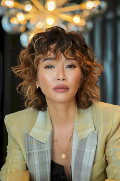 Short Asymmetrical Curly Bob with Blonde Ombre