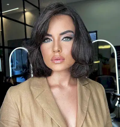 Neck-Length Butterfly Bob with Heavy Layers and Side Part