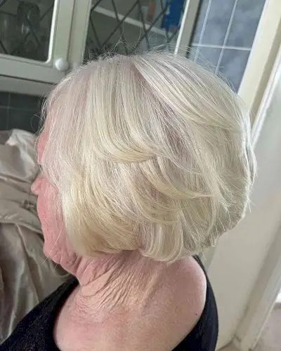 Short Butterfly Wispy White Bob on Older Women