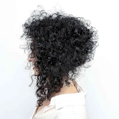 Curly Collarbone-Length Stacked Angled Lob Haircut