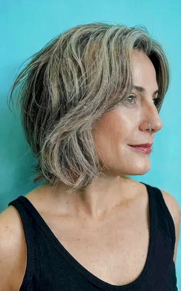 Grown-Out Shaggy Bob with layers for fine-haired women with salt and pepper hair