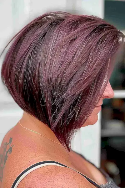 Plum-colored chin-length inverted bob with stacked layers for adding volume to fine hair