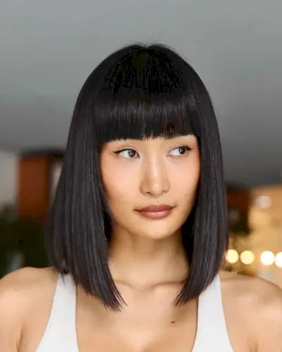 polished sleek bob with full bangs