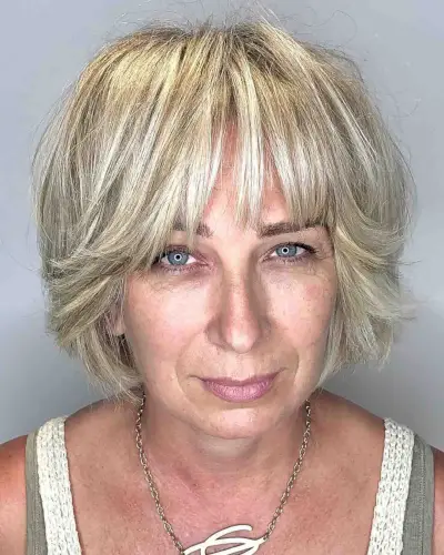 pastel blonde bob with bangs