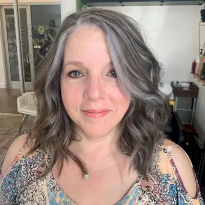 Messy long bobs look best on older women with round faces. Long bobs have multiple layers to create shape and texture and look beautiful styled curly or straight. 