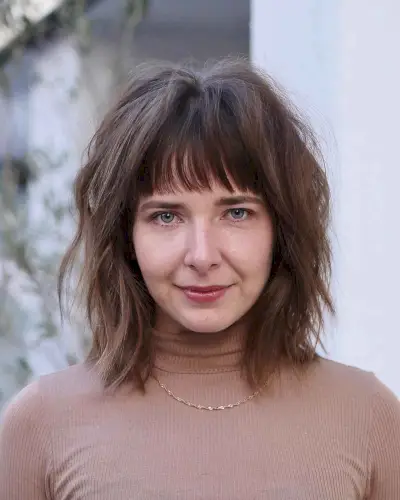 long messy bob with straight bangs